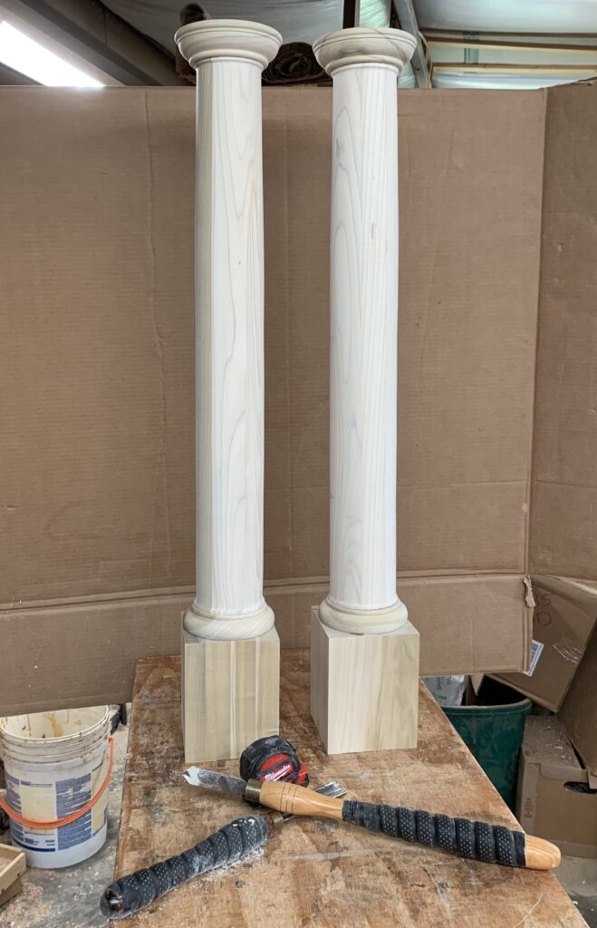 two victorian porch columns side by side